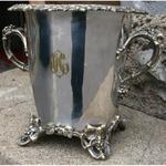 Champagne bucket in silvered metal decoration of vineyards and grapes