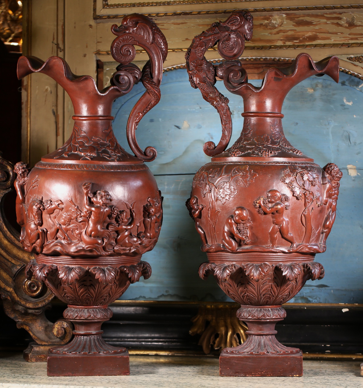 Pair of large Neptune Bacchus ewers